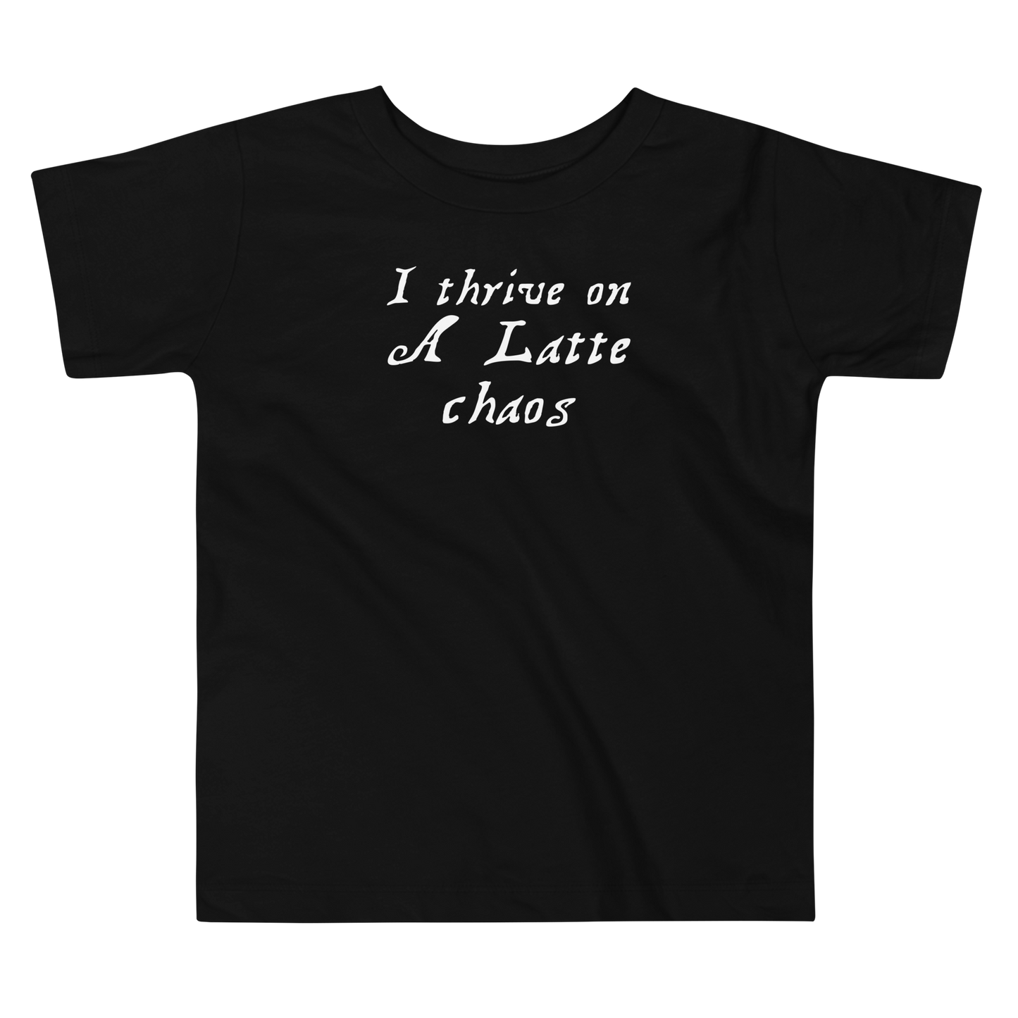 "I thrive on a latte chaos" printed on a black toddler short sleeve tee laying on a flat surface