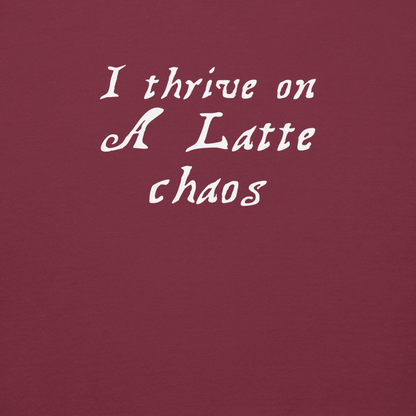 "I thrive on a latte chaos" printed on a maroon background