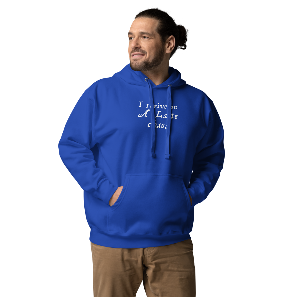 "I thrive on a latte chaos" printed on a team royal unisex hoodie worn by a male