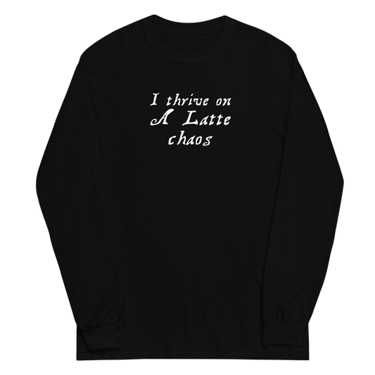 "I thrive on a latte chaos" printed on a black men's long sleeve shirt laying on a flat surface