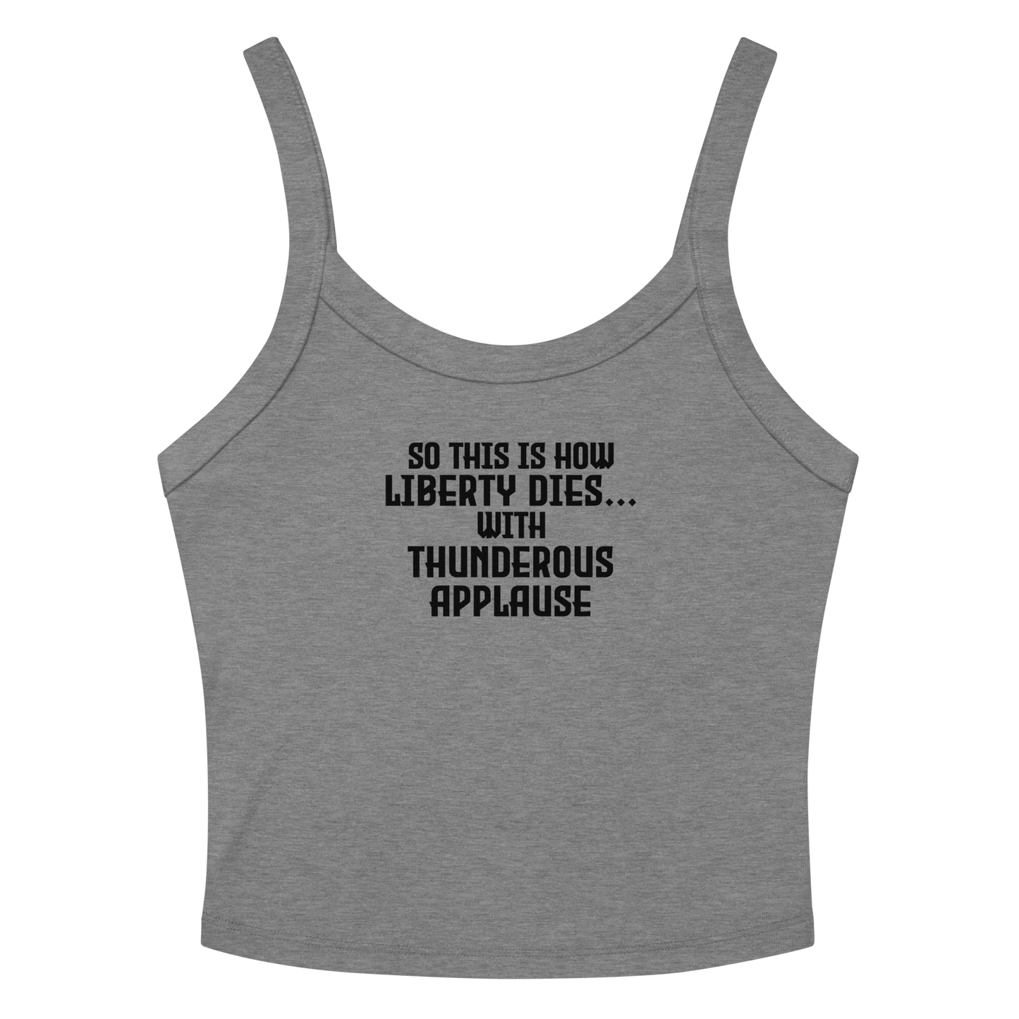 "So this is how liberty dies… with thunderous applause" printed on a athletic heather women's micro-rib tanktop laying on a flat surface amongst sunglasses and shorts