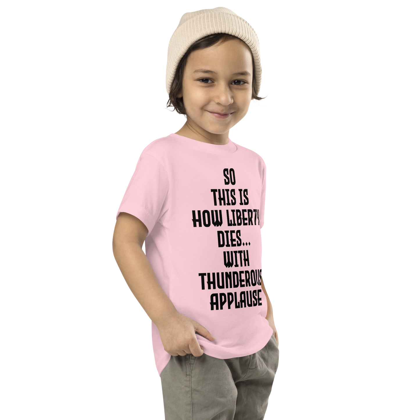 "So this is how liberty dies… with thunderous applause" printed on a pink toddler short sleeve tee worn by a male who is also wearing a knit cap