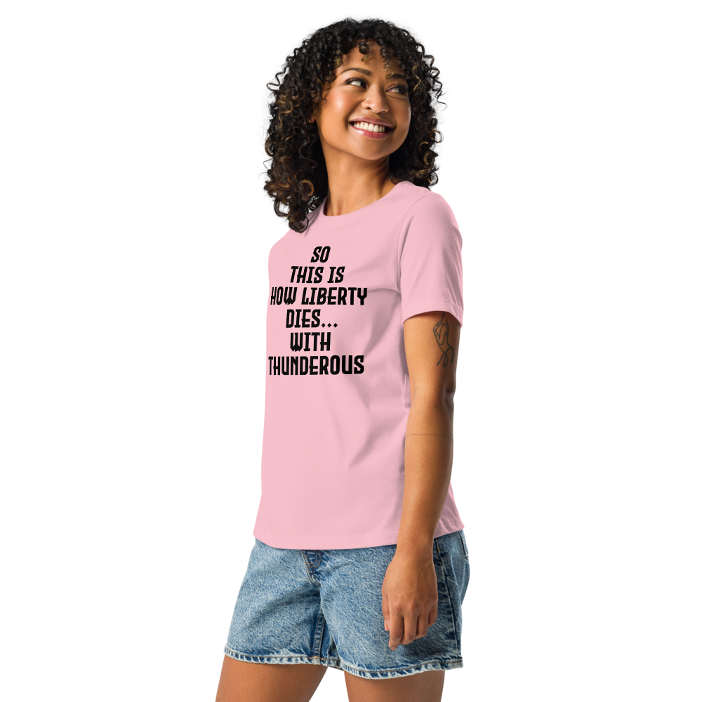 "So this is how liberty dies… with thunderous applause" printed on a pink women's relaxed t-shirt worn by a female