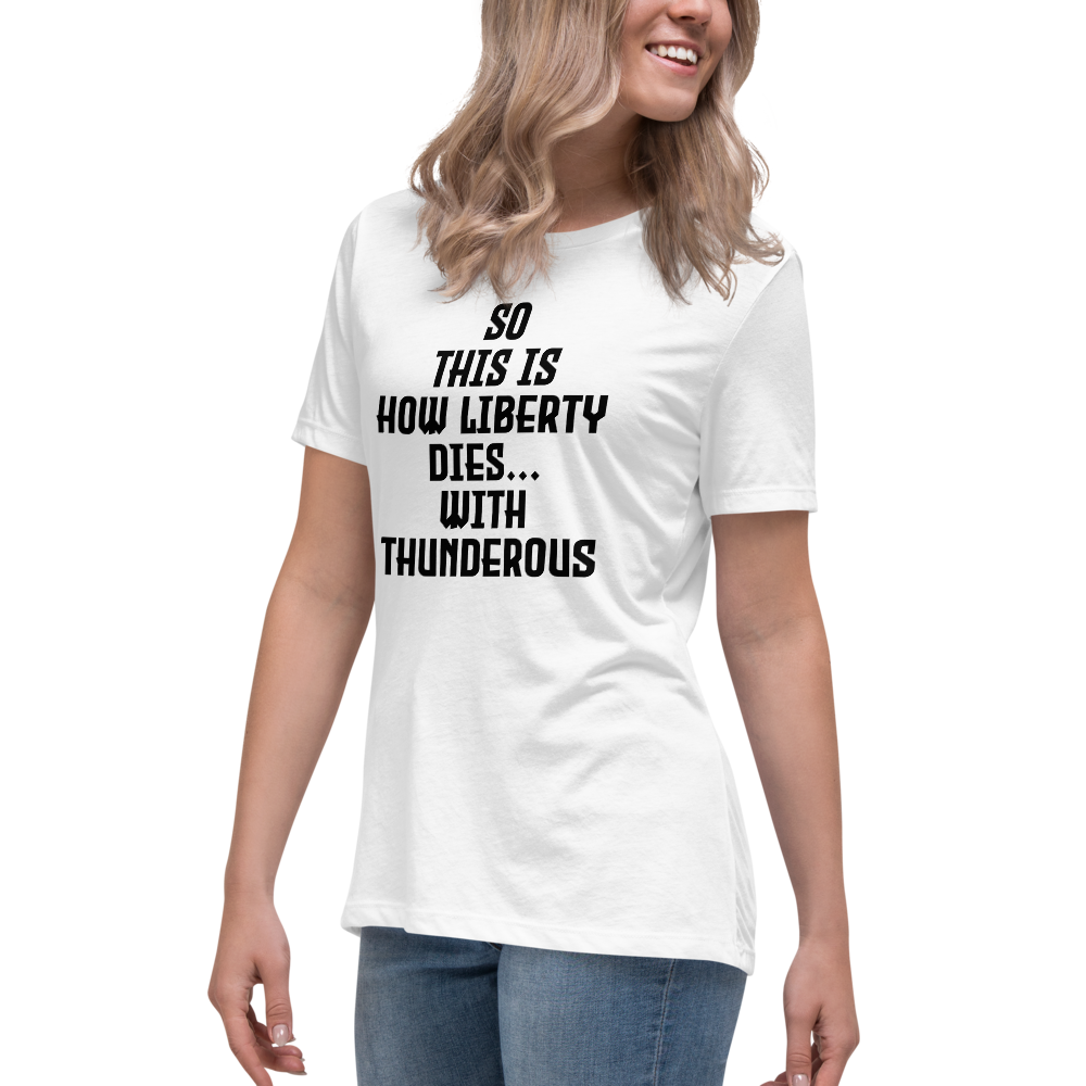 "So this is how liberty dies… with thunderous applause" printed on a white women's relaxed t-shirt worn by a female