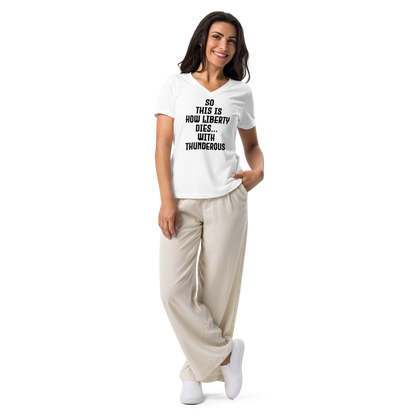 "So this is how liberty dies… with thunderous applause" printed on a solid white blend women's relaxed v-neck t-shirt worn by a female