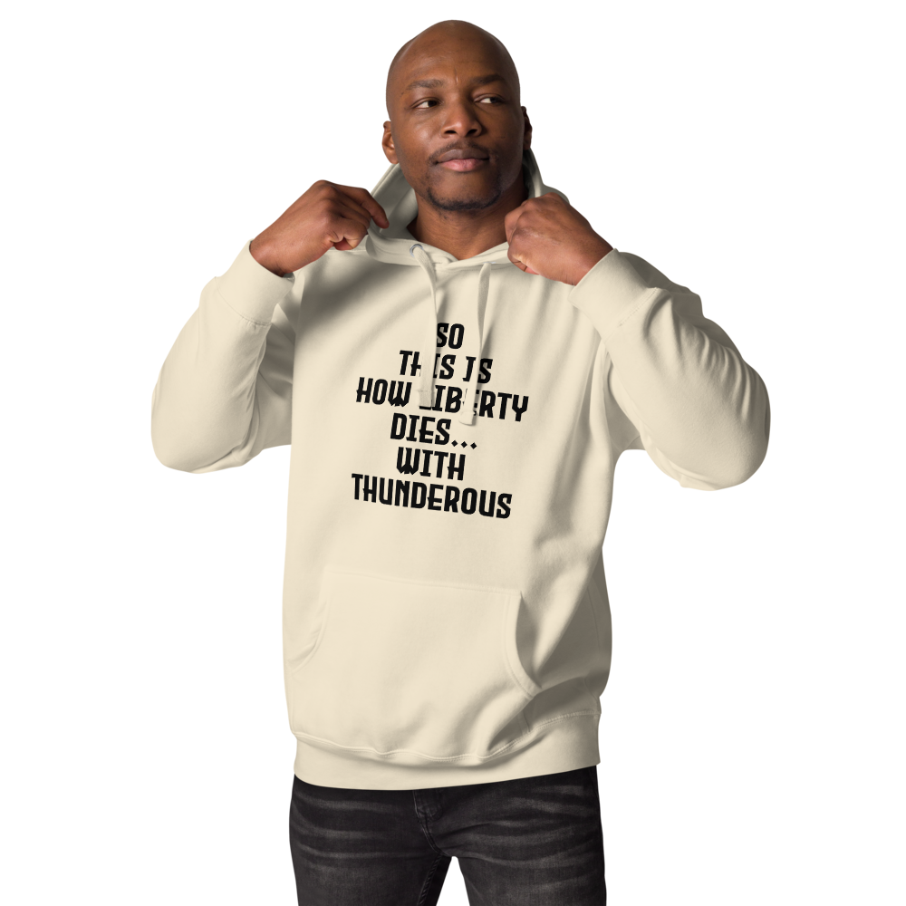 "So this is how liberty dies… with thunderous applause" printed on a bone unisex hoodie worn by a male