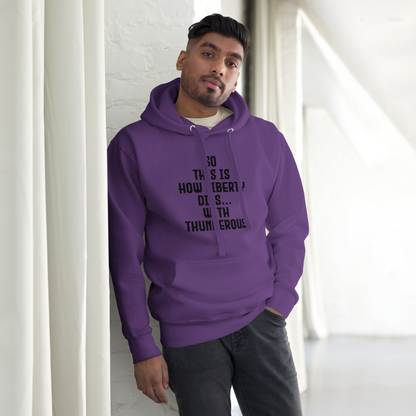 "So this is how liberty dies… with thunderous applause" printed on a purple unisex hoodie worn by a male