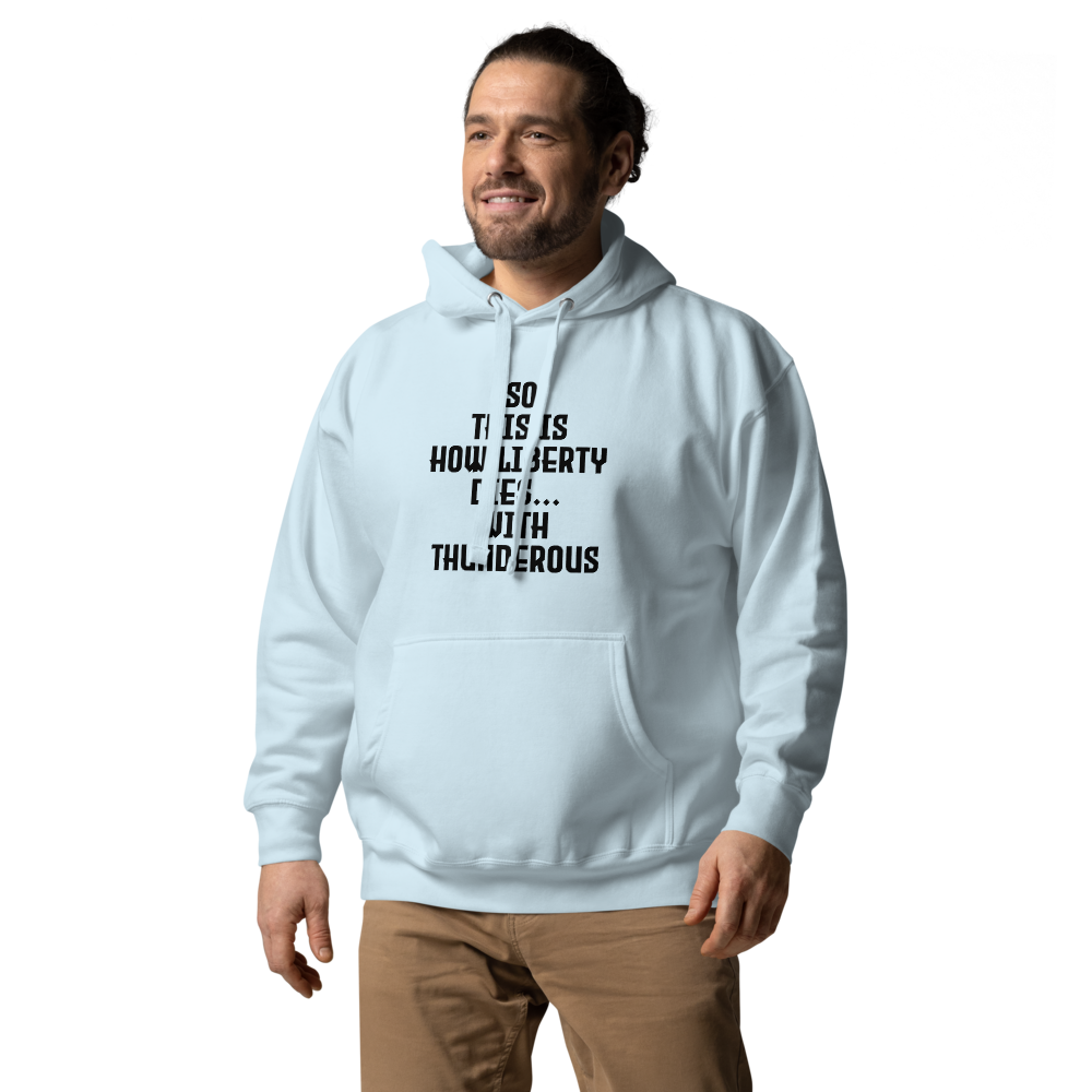 "So this is how liberty dies… with thunderous applause" printed on a sky blue unisex hoodie worn by a male