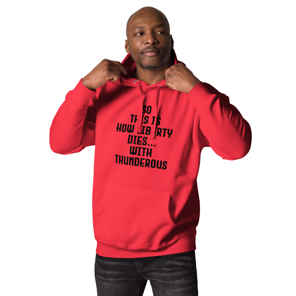 "So this is how liberty dies… with thunderous applause" printed on a team red unisex hoodie worn by a male