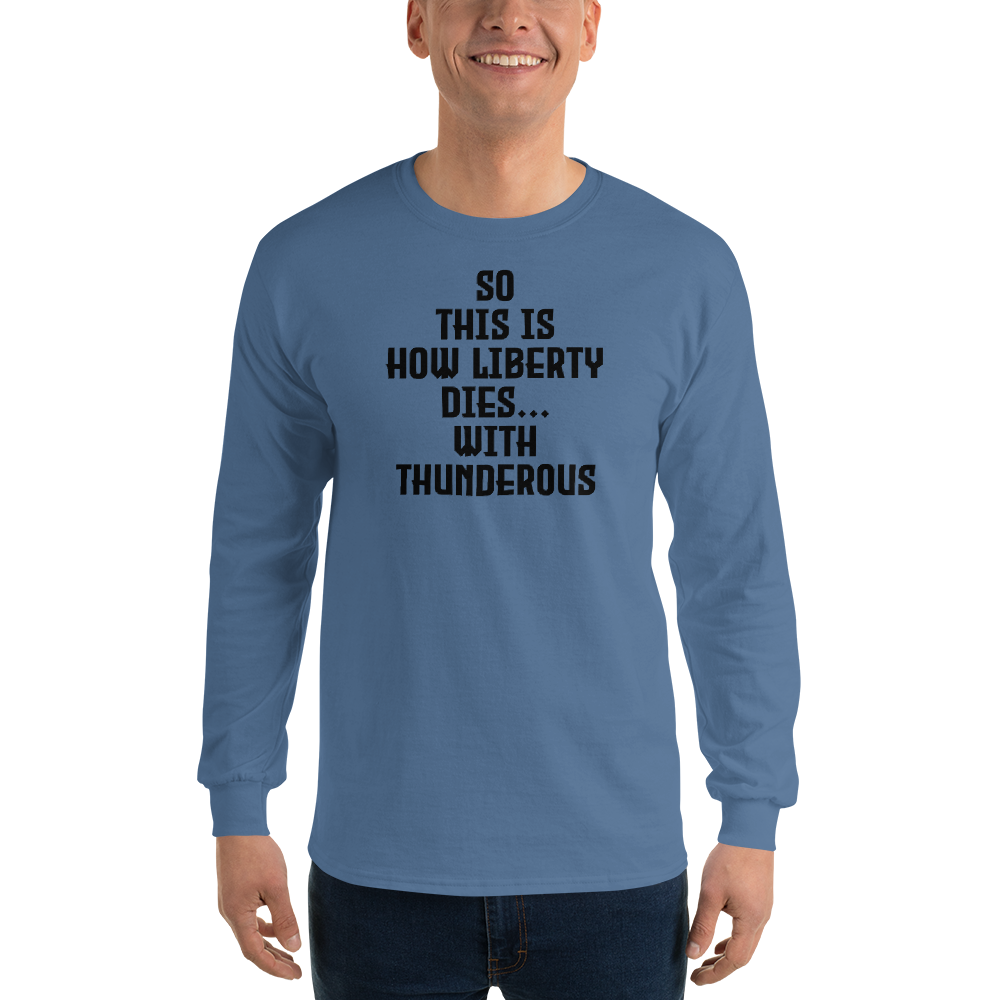 "So this is how liberty dies… with thunderous applause" printed on a indigo blue men's long sleeve shirt worn by a male