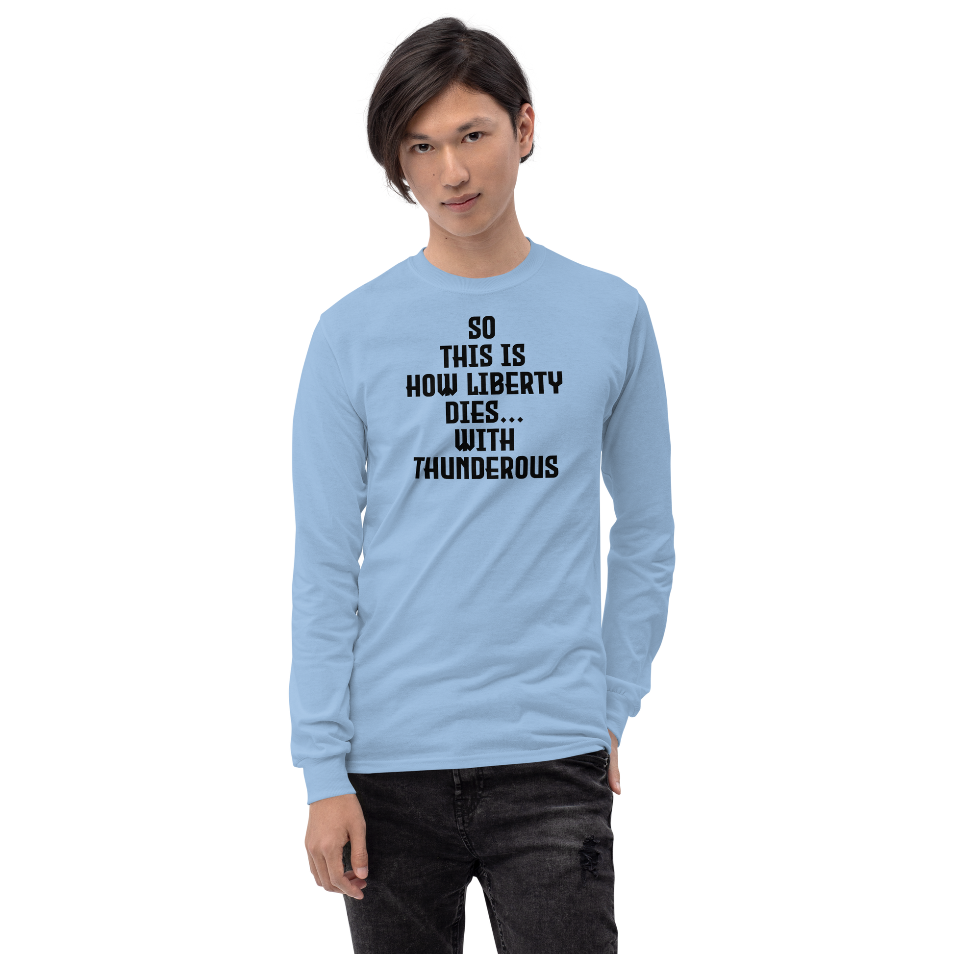 "So this is how liberty dies… with thunderous applause" printed on a light blue men's long sleeve shirt worn by a male