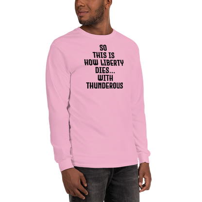 "So this is how liberty dies… with thunderous applause" printed on a light pink men's long sleeve shirt worn by a male