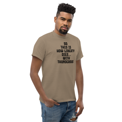 "So this is how liberty dies… with thunderous applause" printed on a brown savana unisex classic tee worn by a male