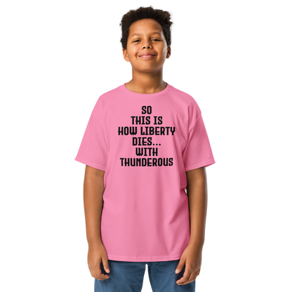 "So this is how liberty dies… with thunderous applause" printed on a azalea youth classic tee worn by a male