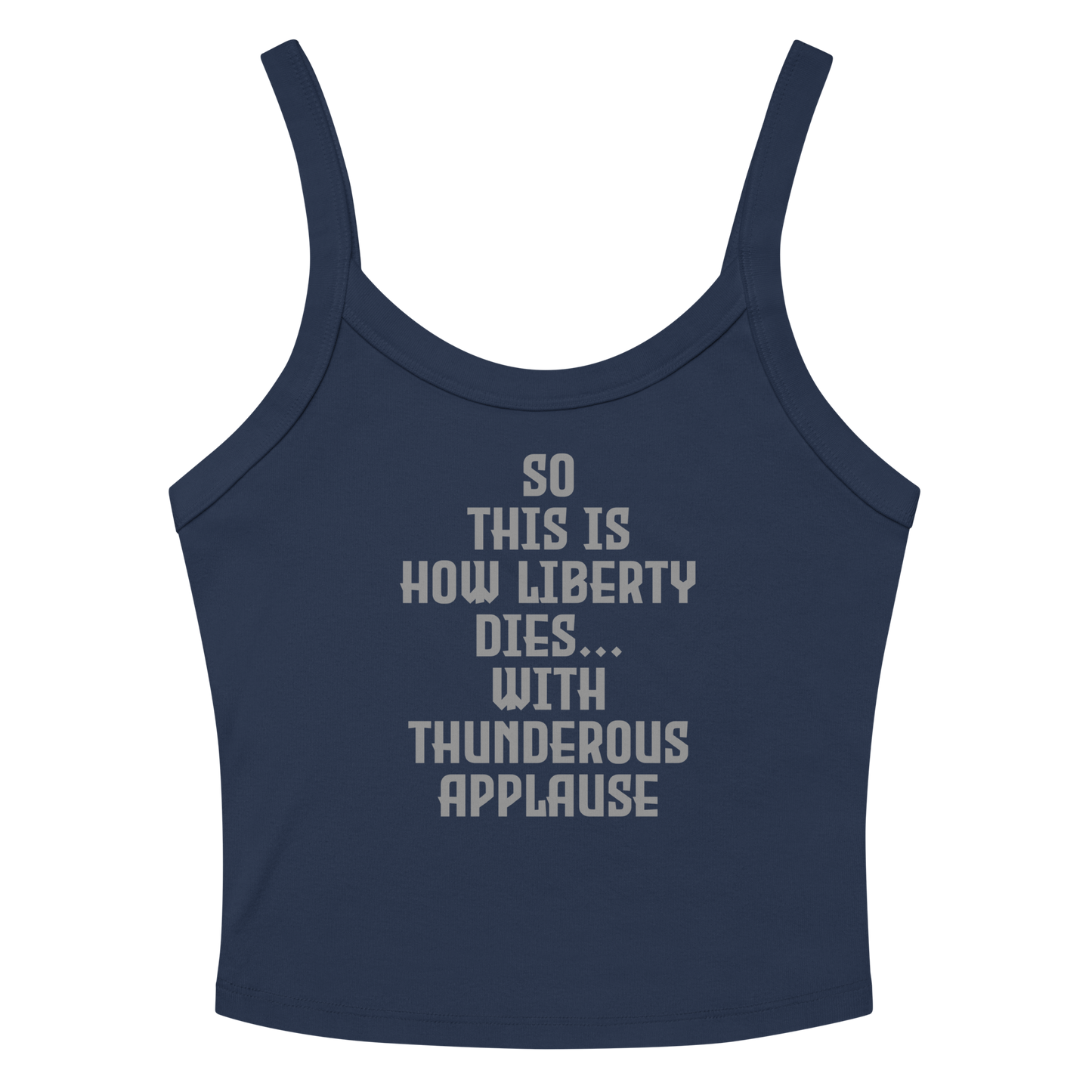 "So this is how liberty dies… with thunderous applause" printed on a solid navy blend women's micro-rib tanktop laying on a flat surface amongst sunglasses and shorts