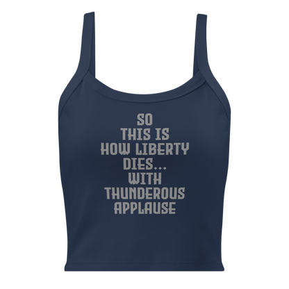 "So this is how liberty dies… with thunderous applause" printed on a solid navy blend women's micro-rib tanktop laying on a flat surface