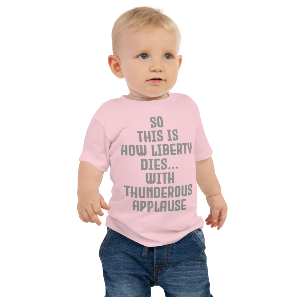 "So this is how liberty dies… with thunderous applause" printed on a pink baby jersey short sleeve tee worn by a male