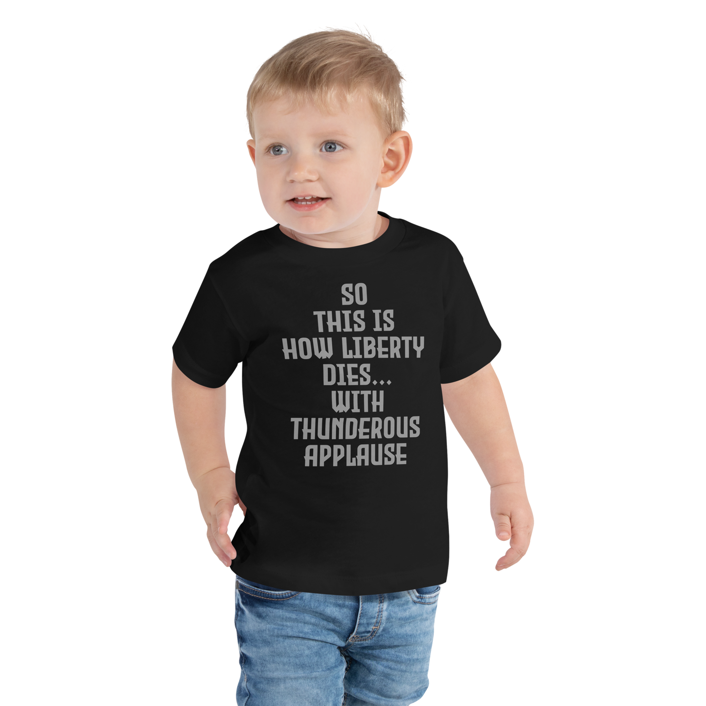 "So this is how liberty dies… with thunderous applause" printed on a black toddler short sleeve tee worn by a male