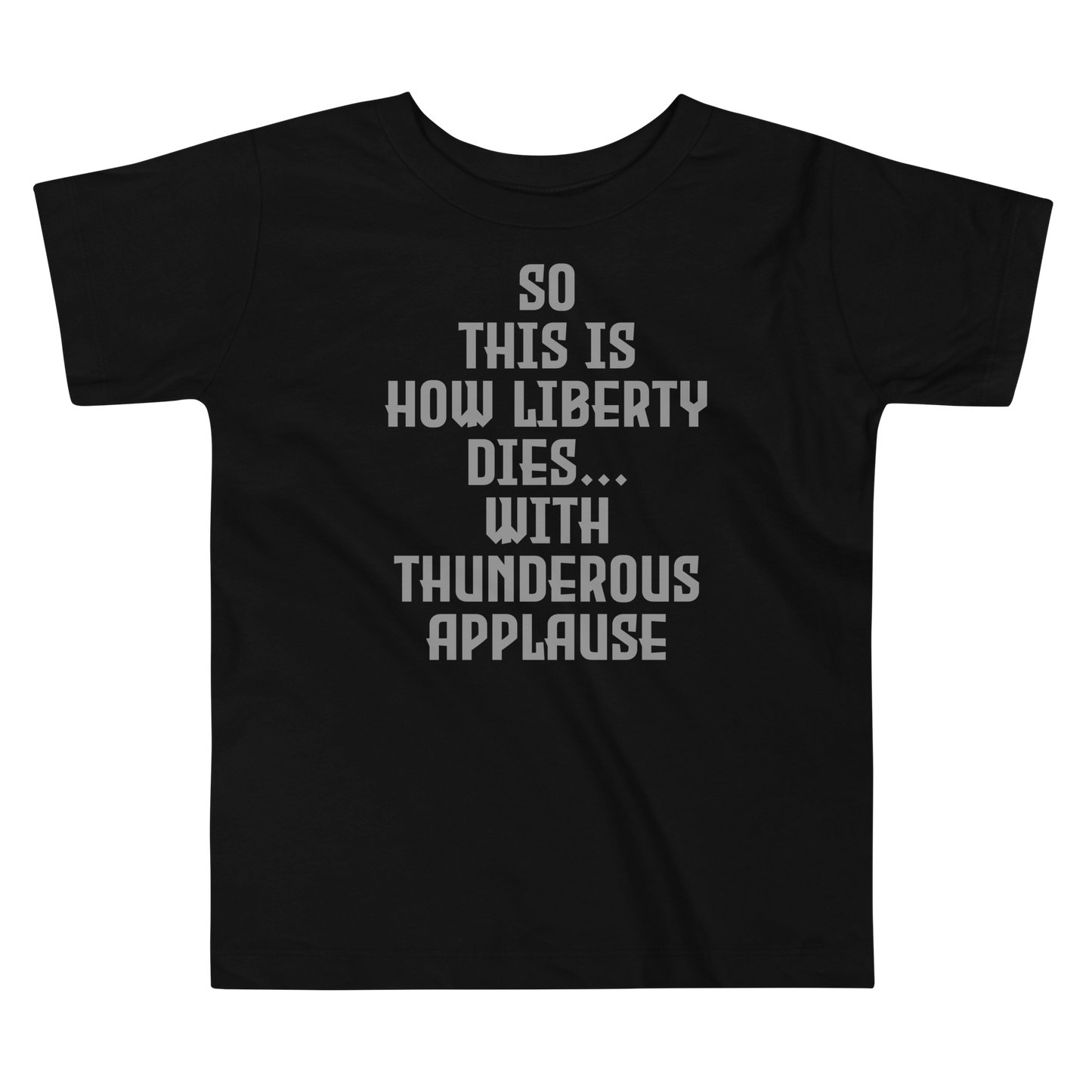 "So this is how liberty dies… with thunderous applause" printed on a black toddler short sleeve tee laying on a flat surface