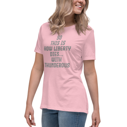 "So this is how liberty dies… with thunderous applause" printed on a pink women's relaxed t-shirt worn by a female