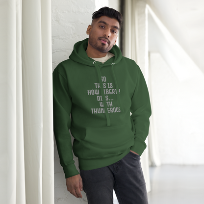 "So this is how liberty dies… with thunderous applause" printed on a forest green unisex hoodie worn by a male