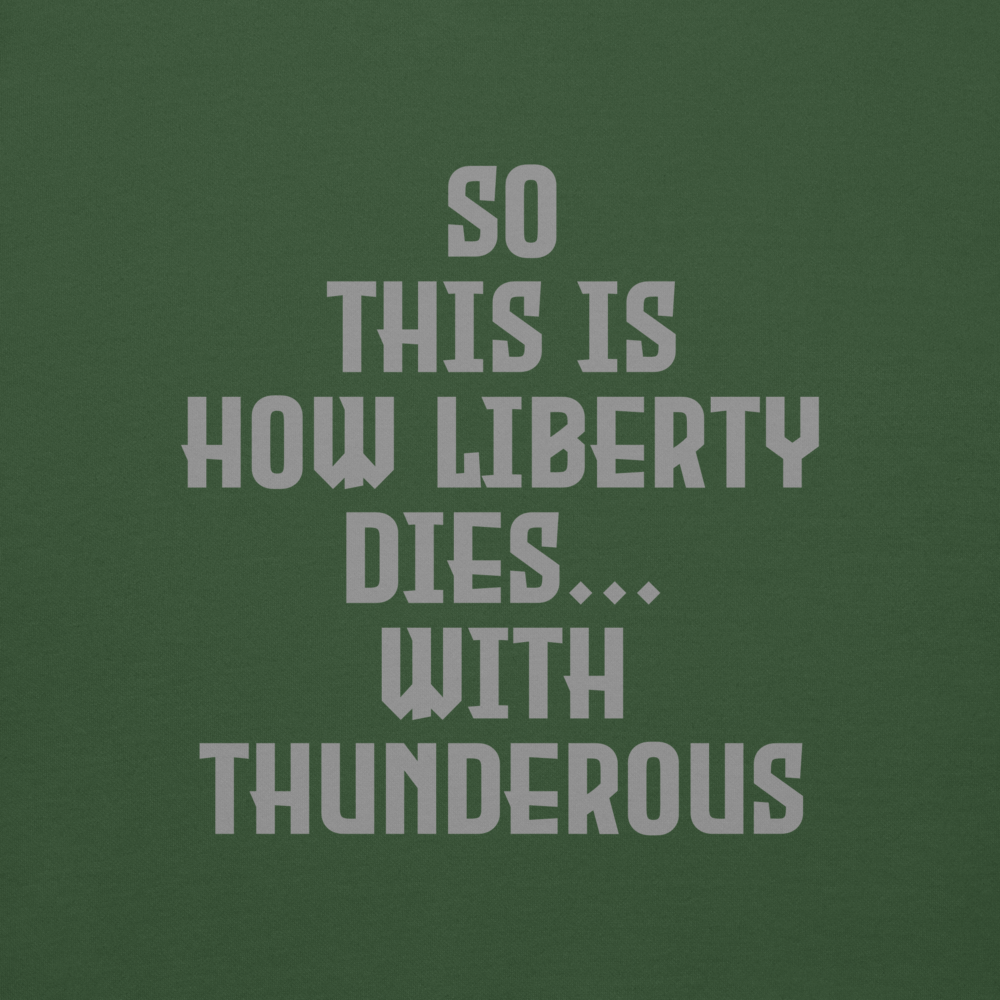 "So this is how liberty dies… with thunderous applause" printed on a forest green background