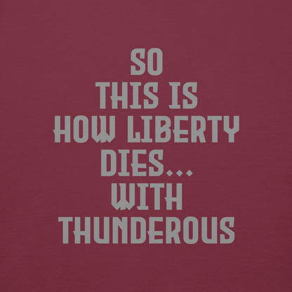 "So this is how liberty dies… with thunderous applause" printed on a maroon background