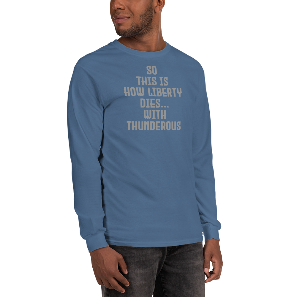 "So this is how liberty dies… with thunderous applause" printed on a indigo blue men's long sleeve shirt worn by a male