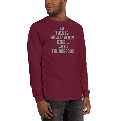 "So this is how liberty dies… with thunderous applause" printed on a maroon men's long sleeve shirt worn by a male