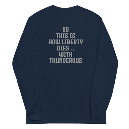 "So this is how liberty dies… with thunderous applause" printed on a navy men's long sleeve shirt laying on a flat surface