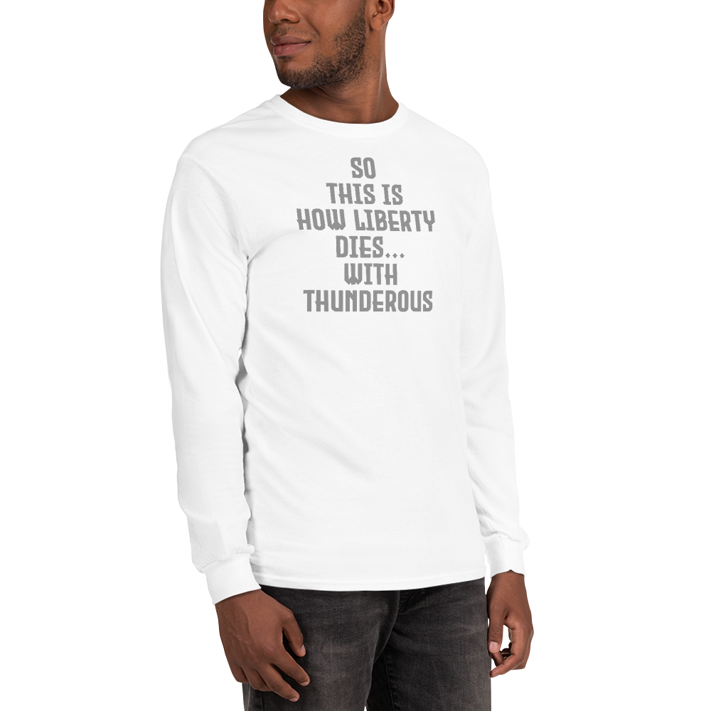 "So this is how liberty dies… with thunderous applause" printed on a white men's long sleeve shirt worn by a male