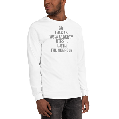 "So this is how liberty dies… with thunderous applause" printed on a white men's long sleeve shirt worn by a male