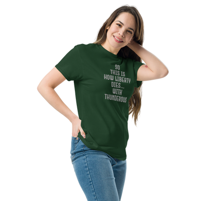 "So this is how liberty dies… with thunderous applause" printed on a forest green unisex classic tee worn by a female