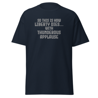 "So this is how liberty dies… with thunderous applause" printed on a navy on an invisible body