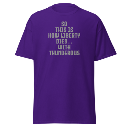 "So this is how liberty dies… with thunderous applause" printed on a purple on an invisible body