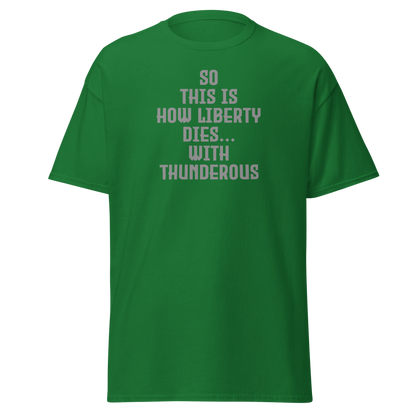 "So this is how liberty dies… with thunderous applause" printed on a turf green on an invisible body