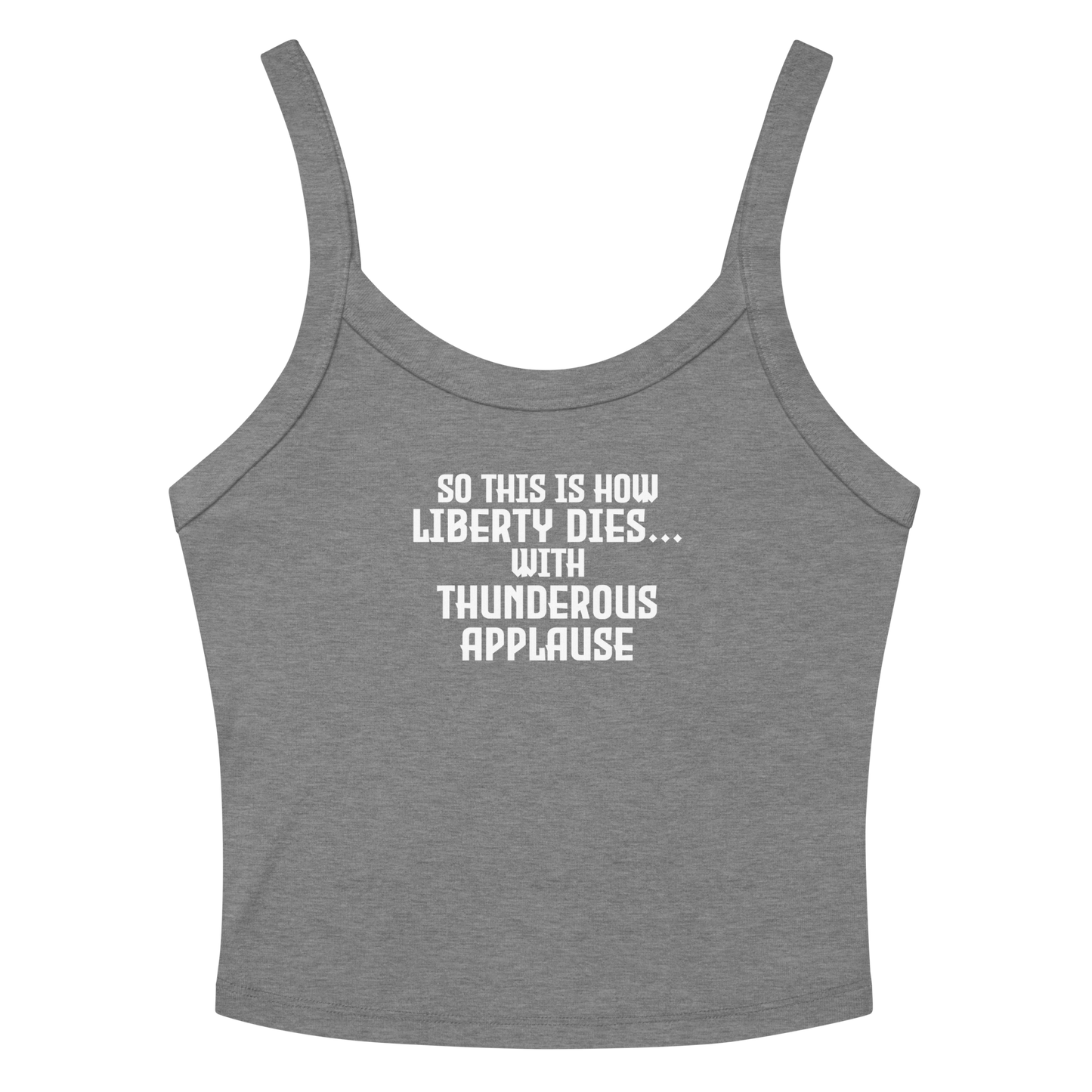 "So this is how liberty dies… with thunderous applause" printed on a athletic heather women's micro-rib tanktop laying on a flat surface amongst sunglasses and shorts