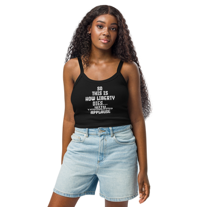 "So this is how liberty dies… with thunderous applause" printed on a solid black blend women's micro-rib tanktop worn by a female