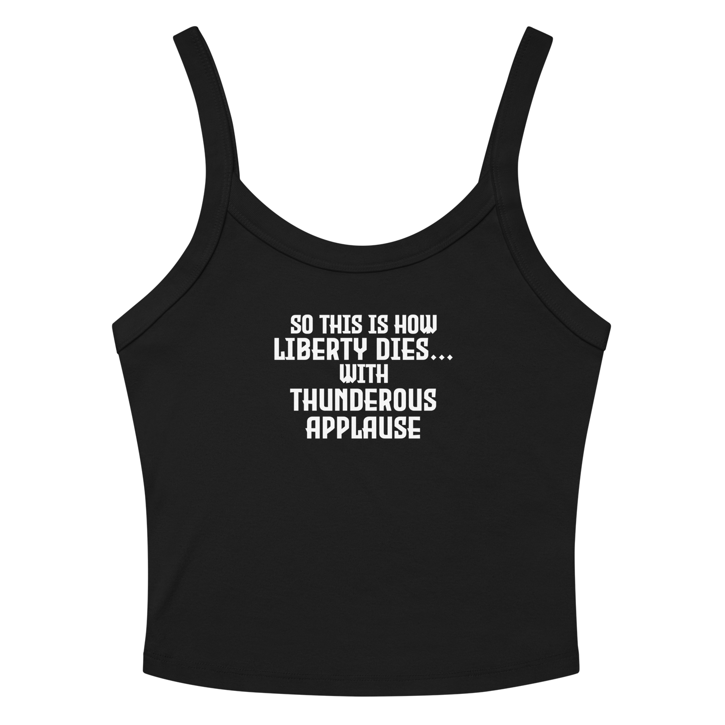 "So this is how liberty dies… with thunderous applause" printed on a solid black blend women's micro-rib tanktop laying on a flat surface amongst sunglasses and shorts