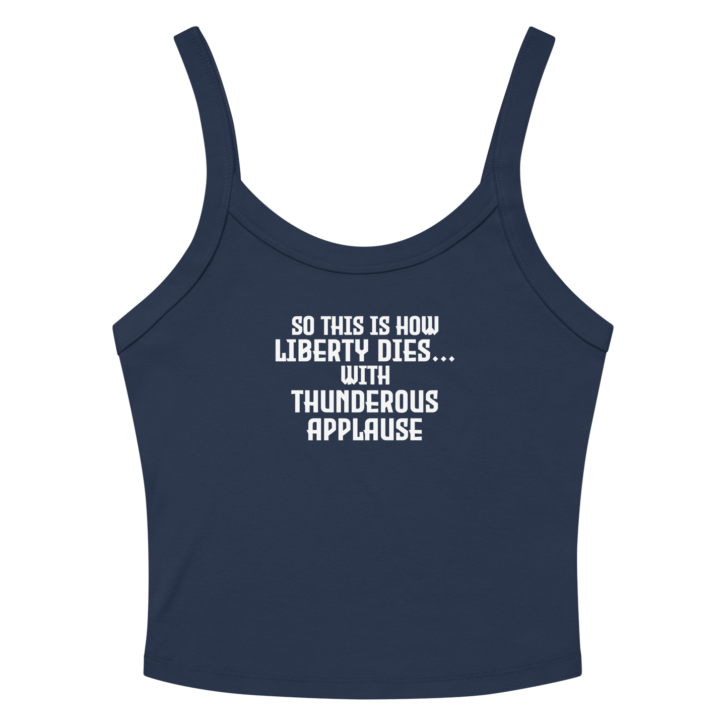 "So this is how liberty dies… with thunderous applause" printed on a solid navy blend women's micro-rib tanktop laying on a flat surface amongst sunglasses and shorts