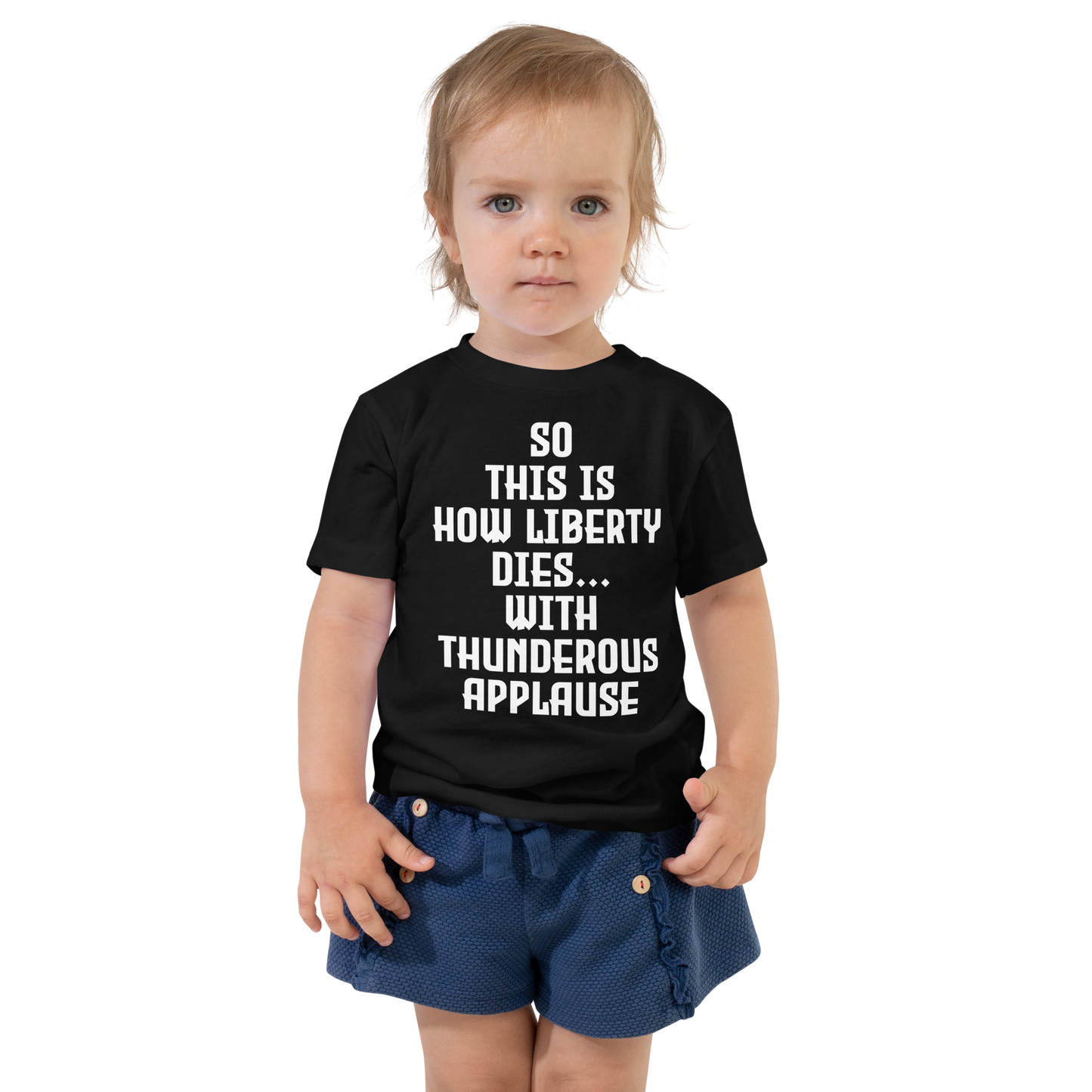 "So this is how liberty dies… with thunderous applause" printed on a black toddler short sleeve tee worn by a female