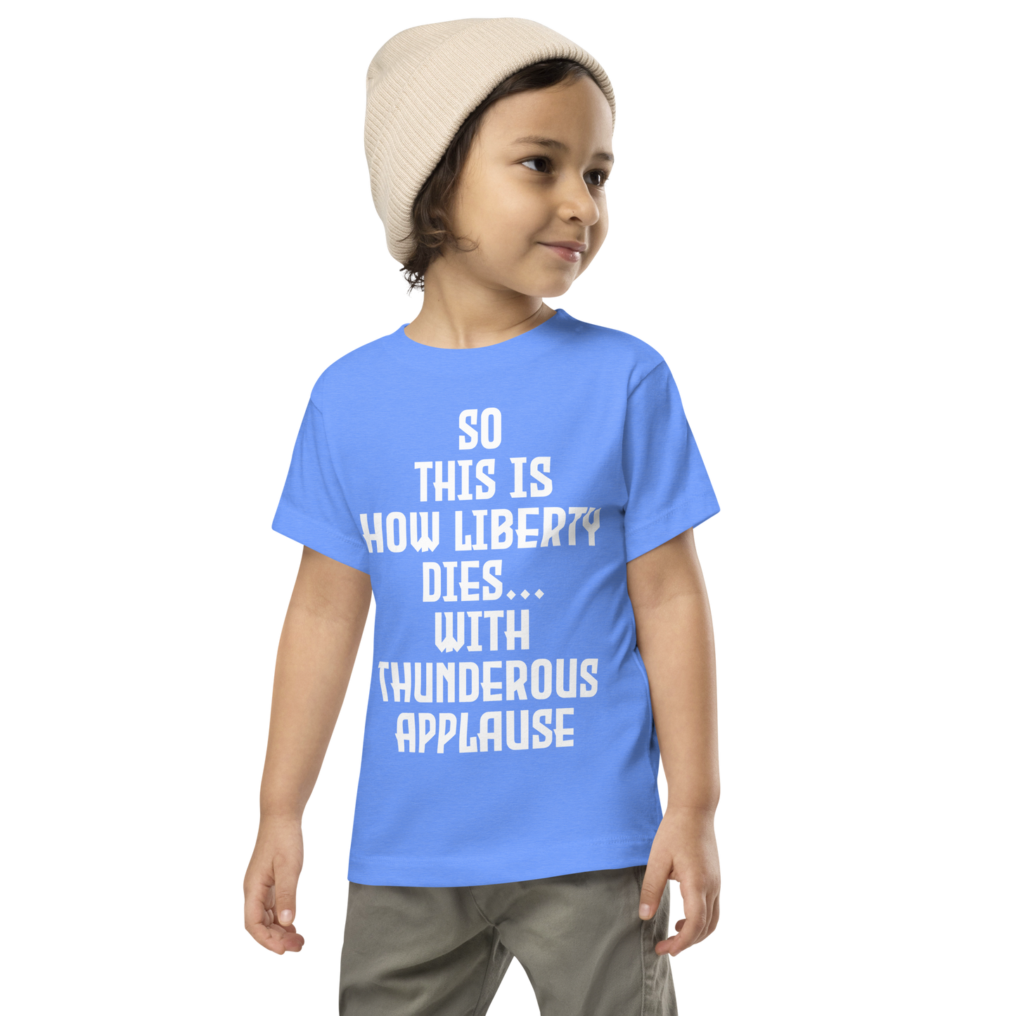 "So this is how liberty dies… with thunderous applause" printed on a heather columbia blue toddler short sleeve tee worn by a male wearing a cap