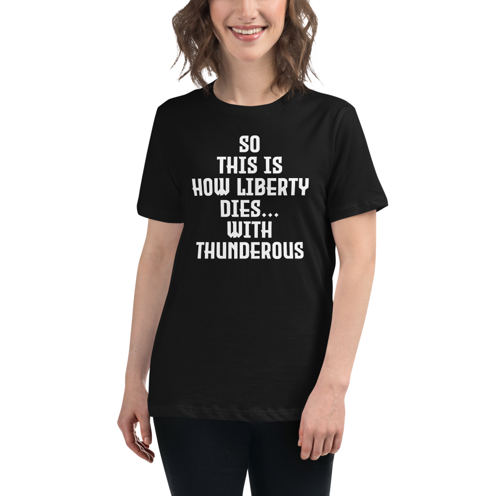 "So this is how liberty dies… with thunderous applause" printed on a black women's relaxed t-shirt worn by a female