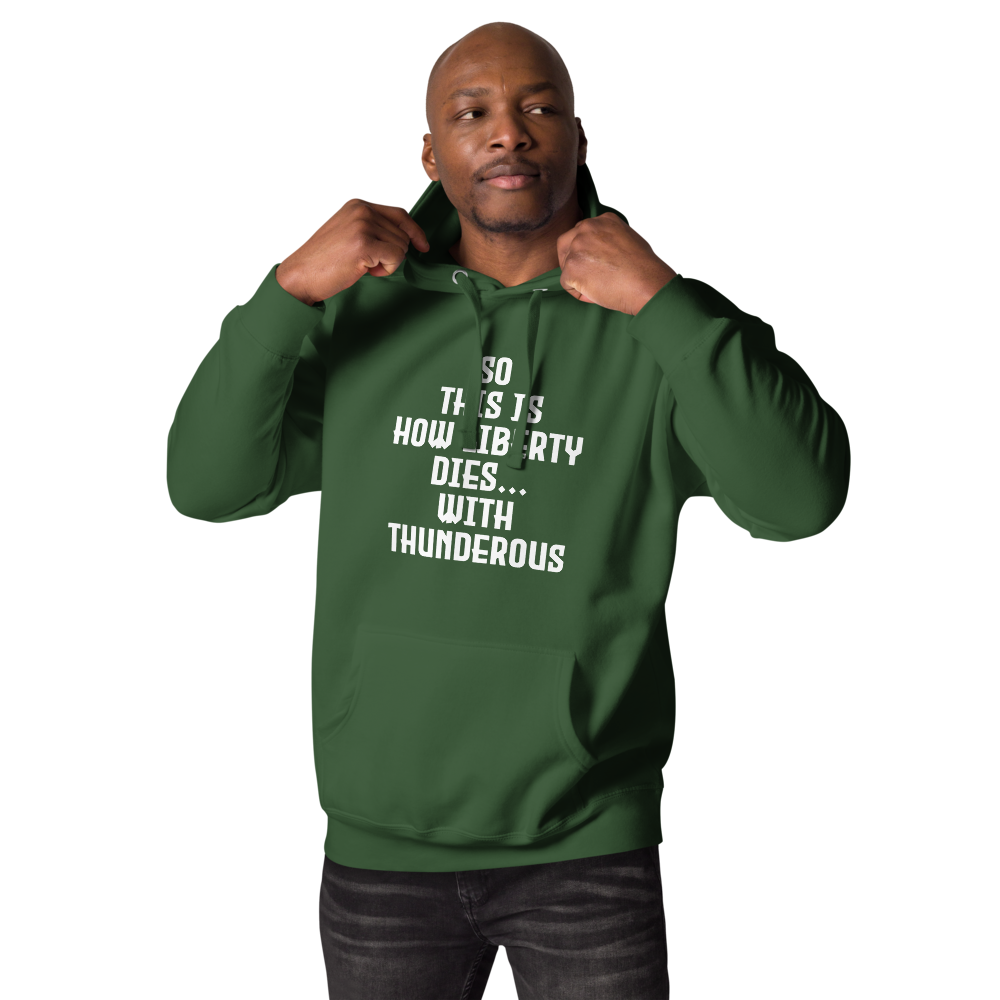 "So this is how liberty dies… with thunderous applause" printed on a forest green unisex hoodie worn by a male