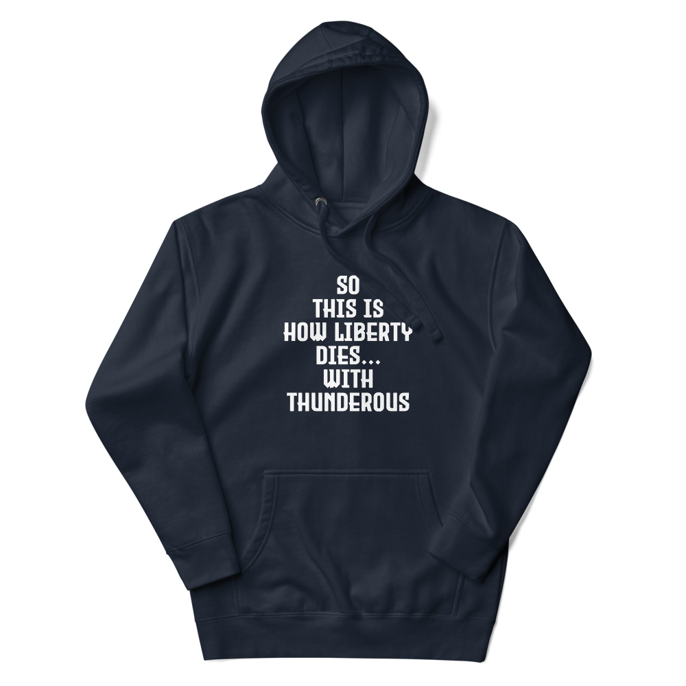 "So this is how liberty dies… with thunderous applause" printed on a navy blazer unisex hoodie laying on a flat surface with the hood up
