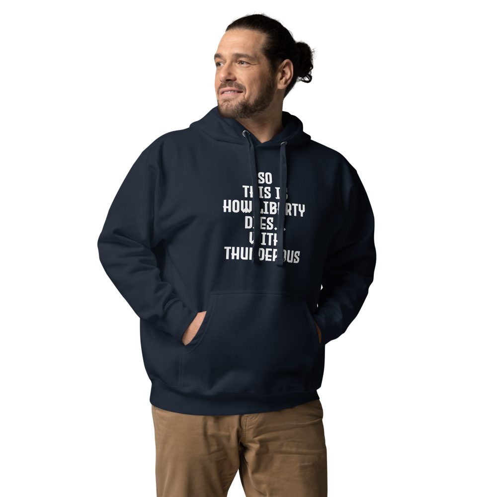 "So this is how liberty dies… with thunderous applause" printed on a navy blazer unisex hoodie worn by a male