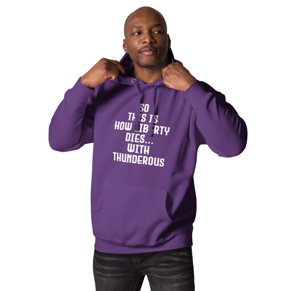 "So this is how liberty dies… with thunderous applause" printed on a purple unisex hoodie worn by a male