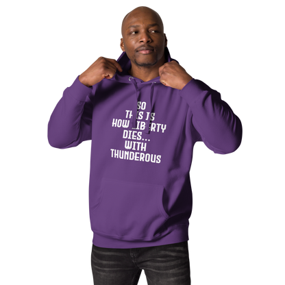 "So this is how liberty dies… with thunderous applause" printed on a purple unisex hoodie worn by a male