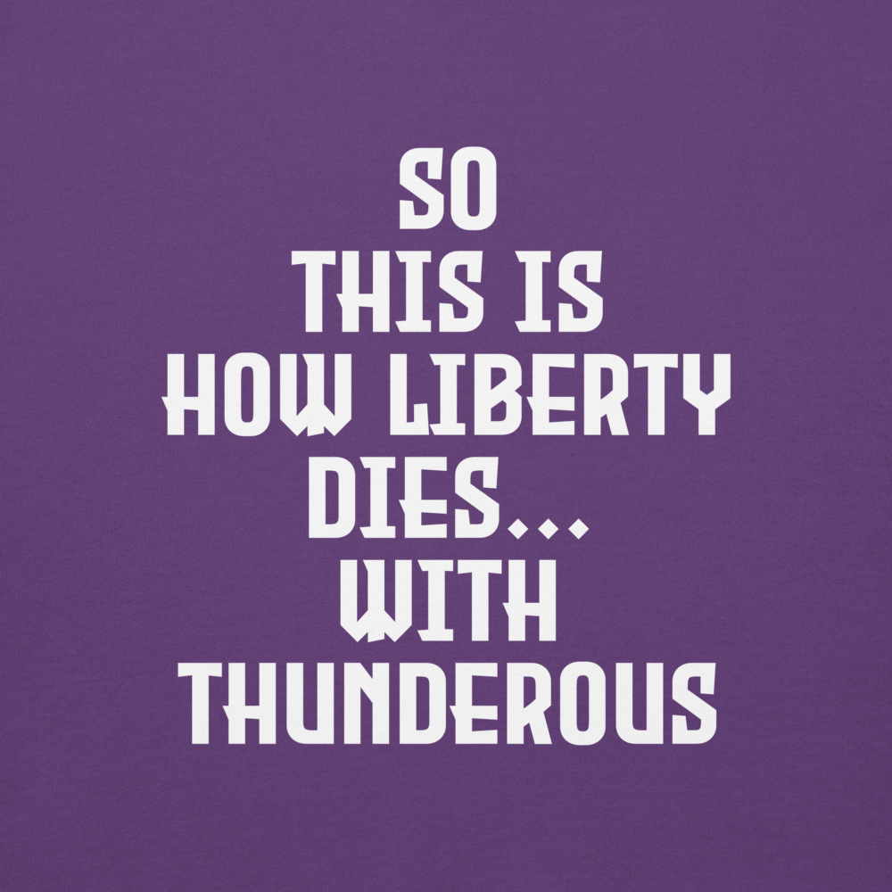 "So this is how liberty dies… with thunderous applause" printed on a purple background