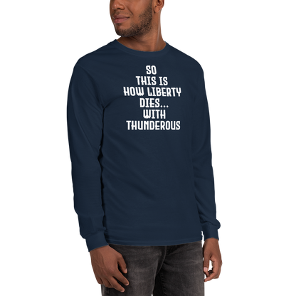 "So this is how liberty dies… with thunderous applause" printed on a navy men's long sleeve shirt worn by a male